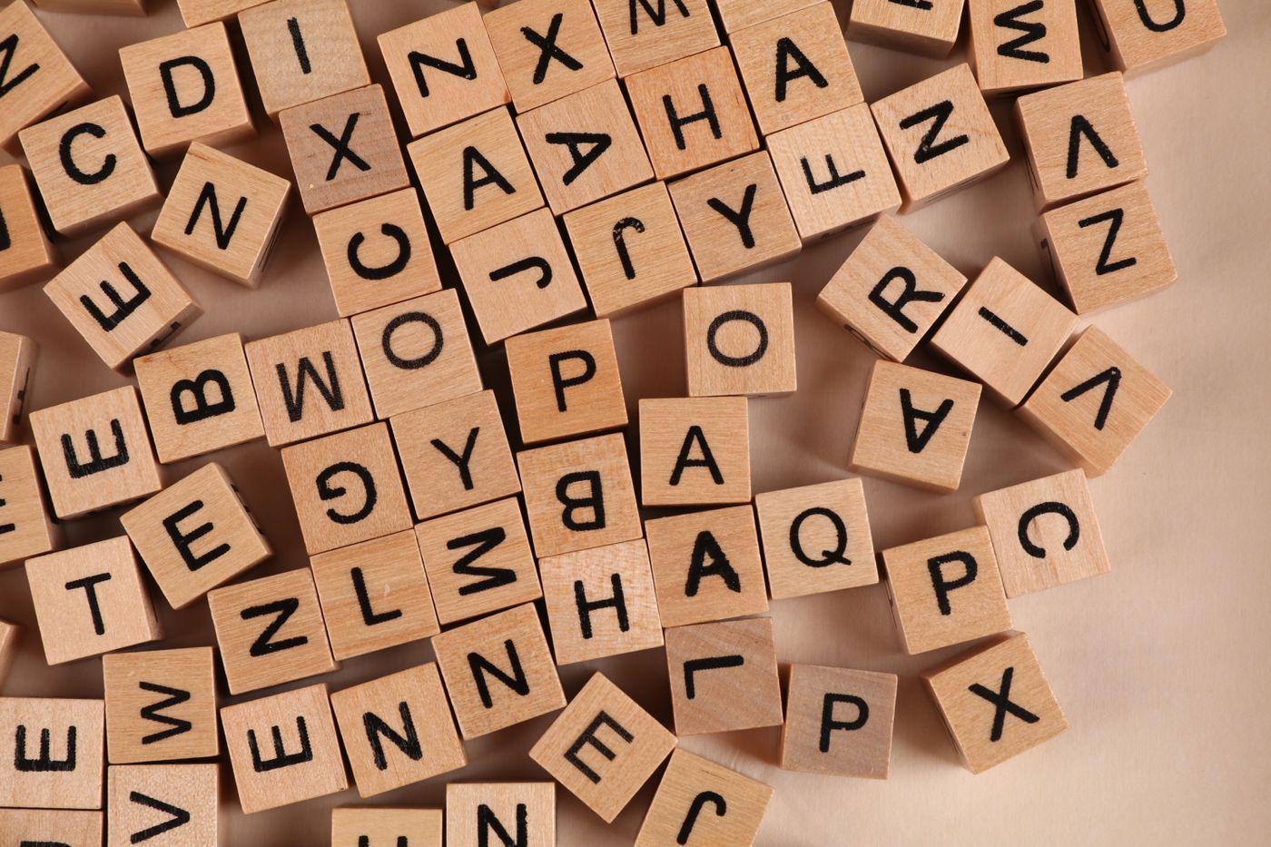 Wooden blocks display individual letters of the alphabet.