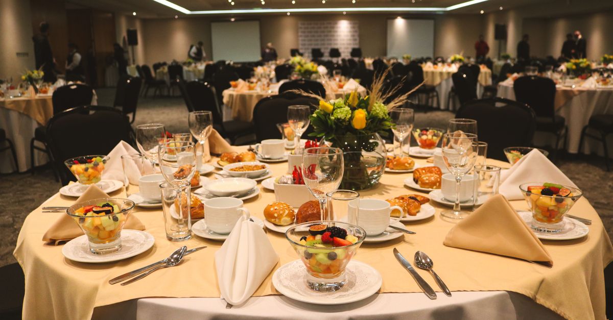 A banquet room is set for a formal dinner.