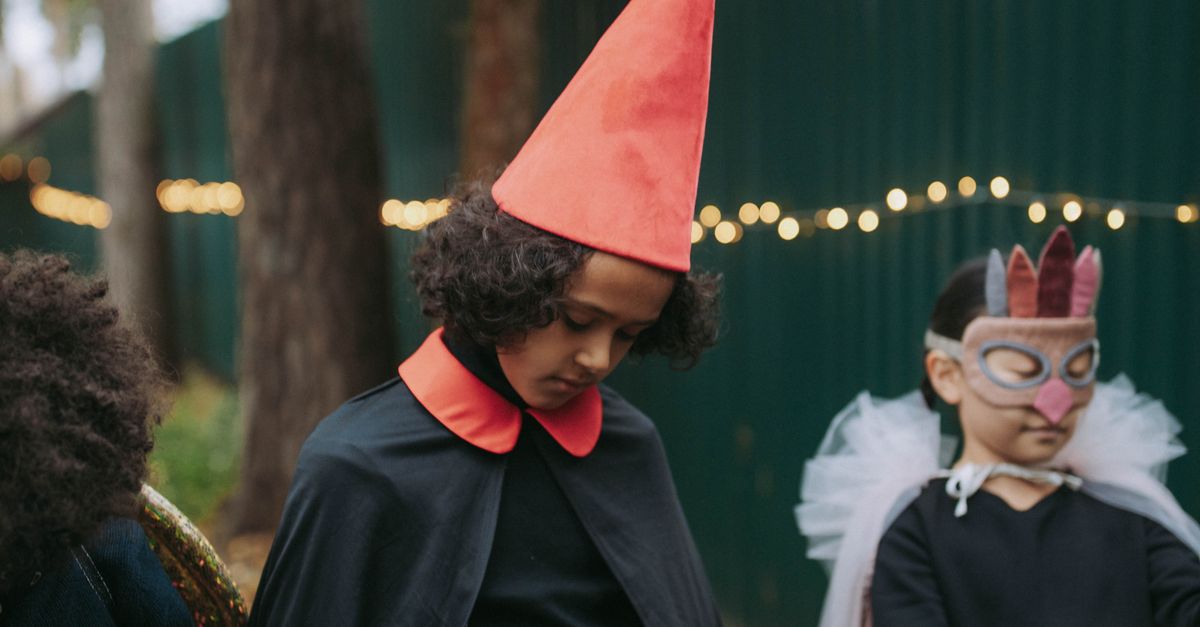 Children in Halloween costumes take part in a seasonal activity.