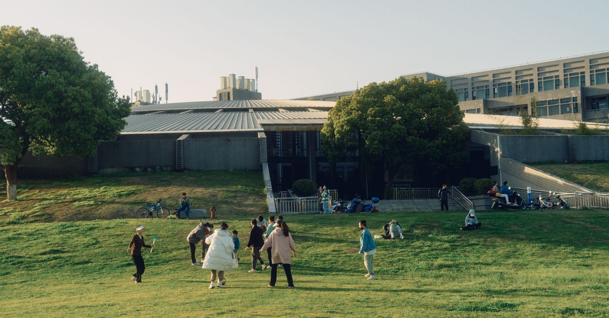 Families use an outdoor recreation field.